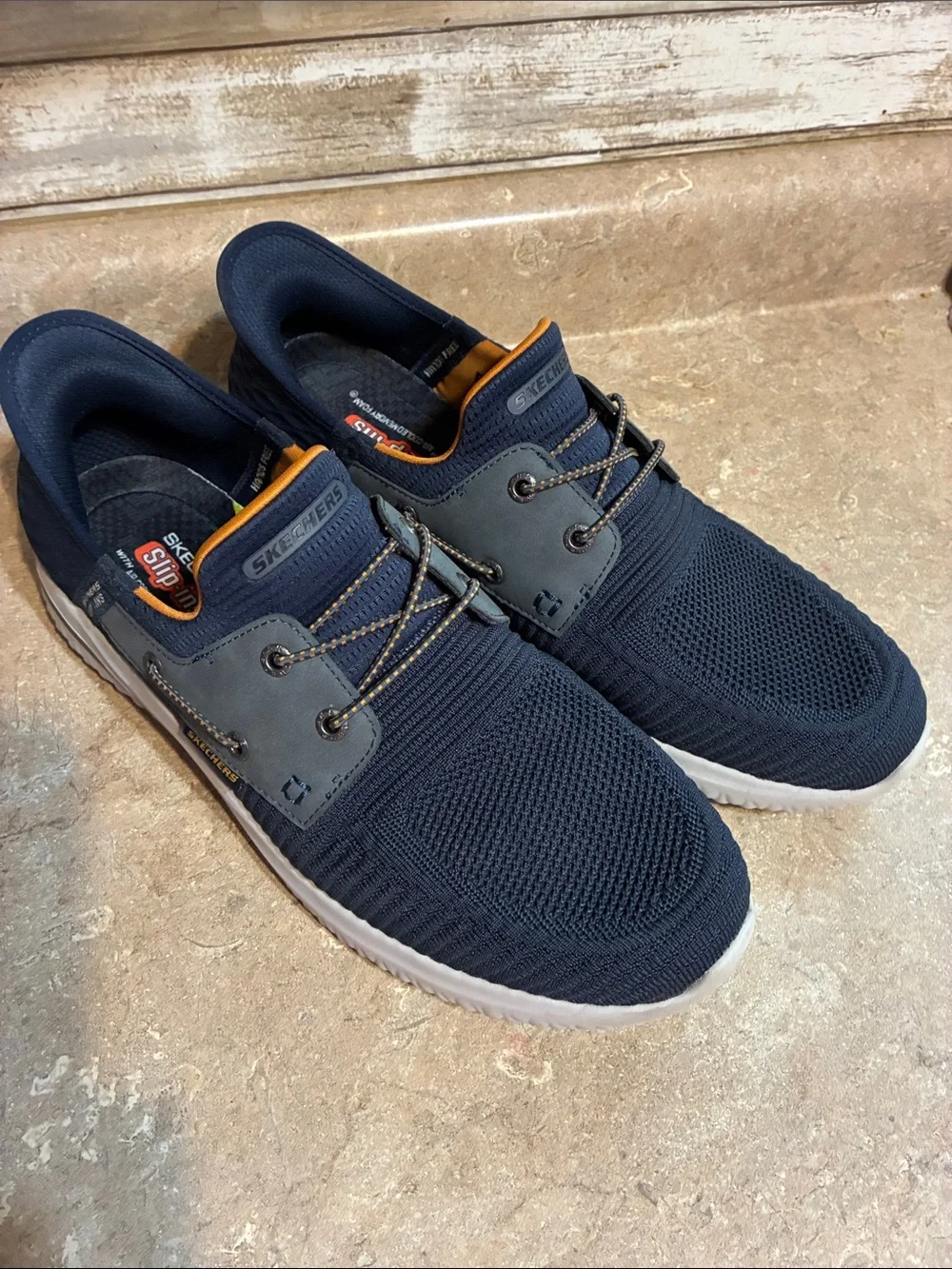 Skechers Men's Size 12 Navy Knit Slip-On Sneakers with Orange Liner